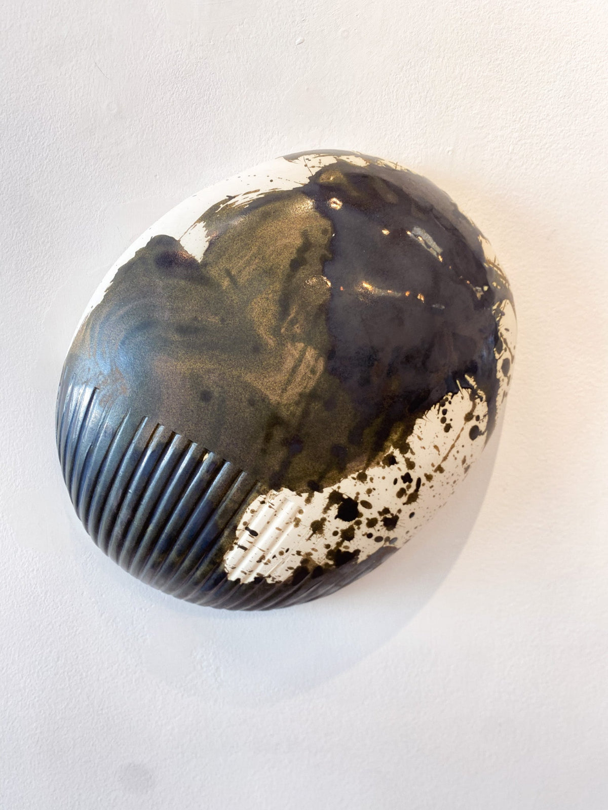 Decorative stone with marbled pattern on a white background