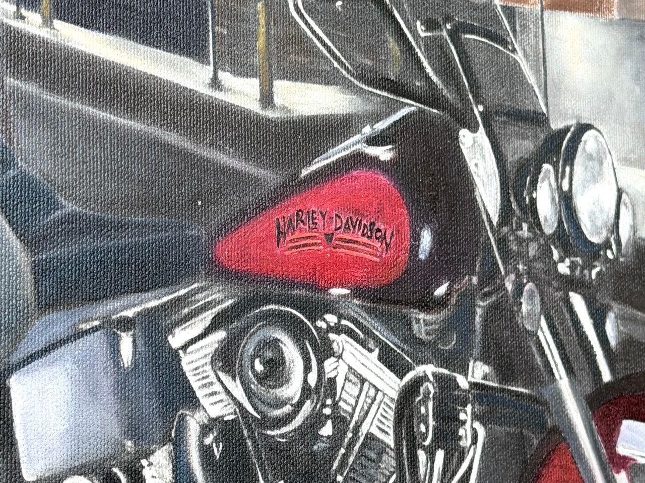 Harley Davidson motorcycle with a close-up of the headlight and emblem.